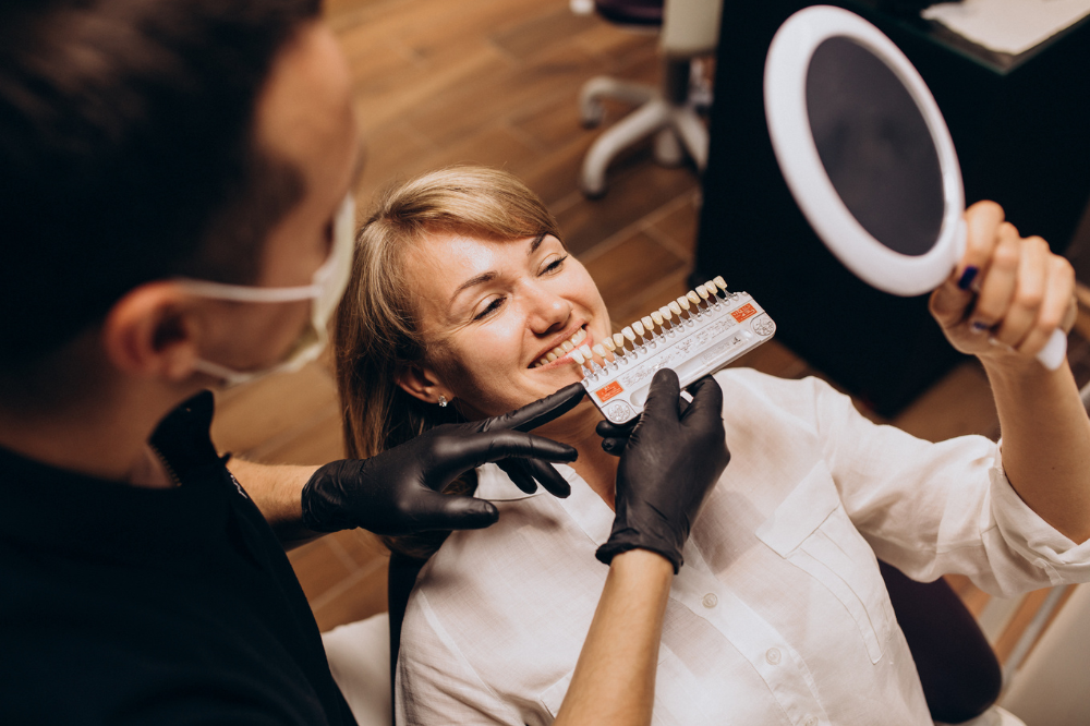 a woman is getting dental treatment