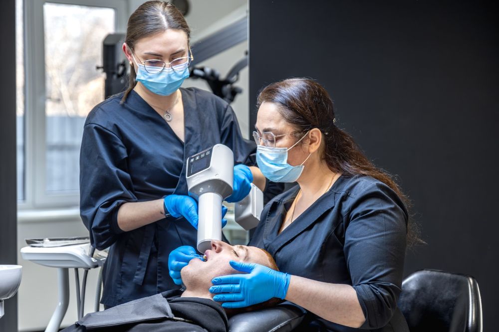 a man is getting dental treatment